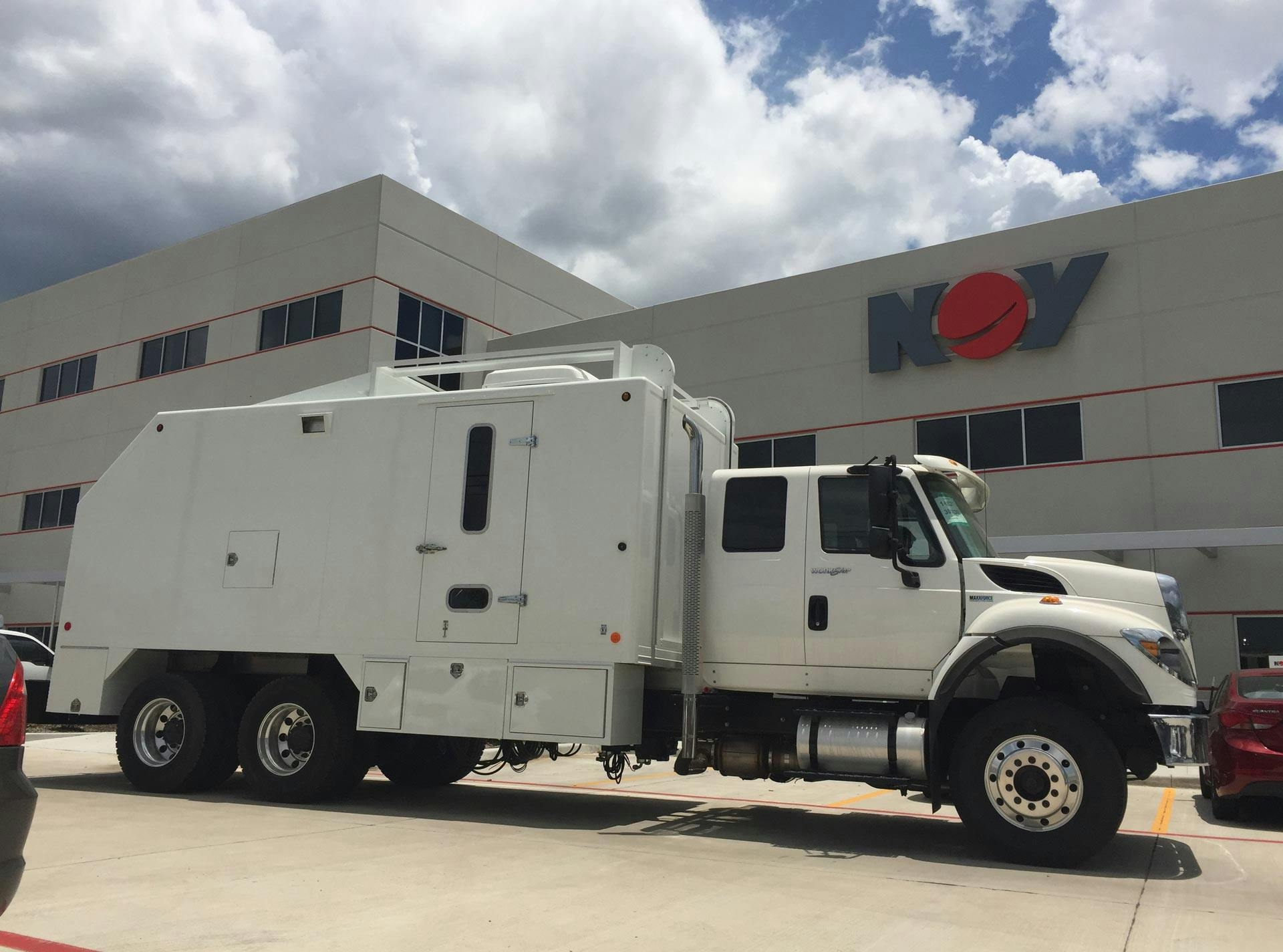 Artex Wireline Truck in front on a NOV facility