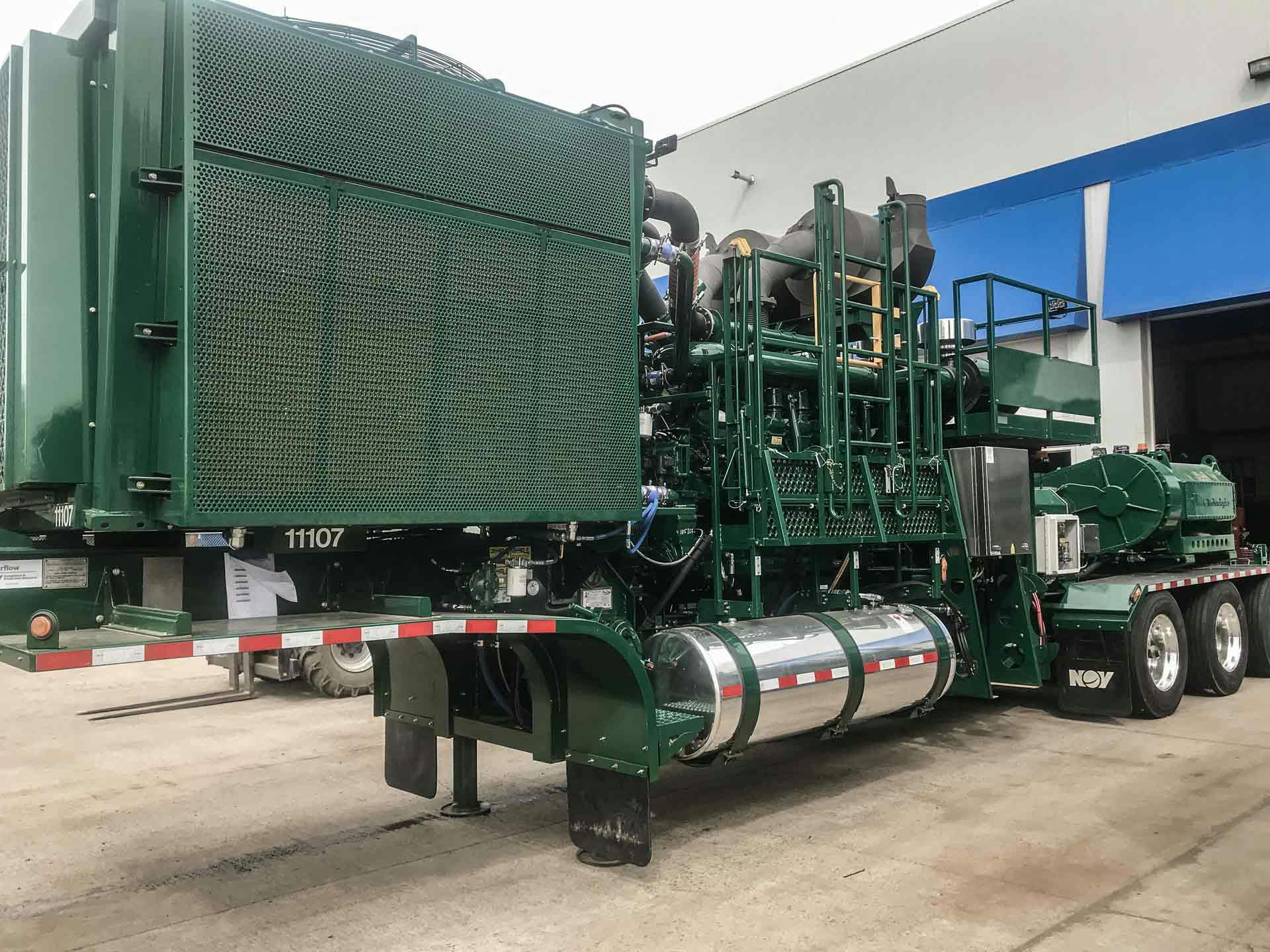 A green Enerflow parked truck