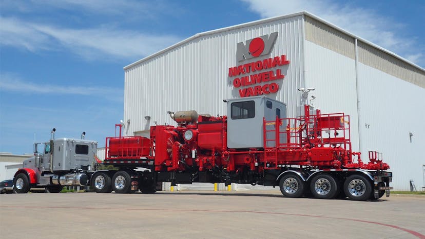 A truck-mounted Enerflow product parked in front of an NOV warehouse