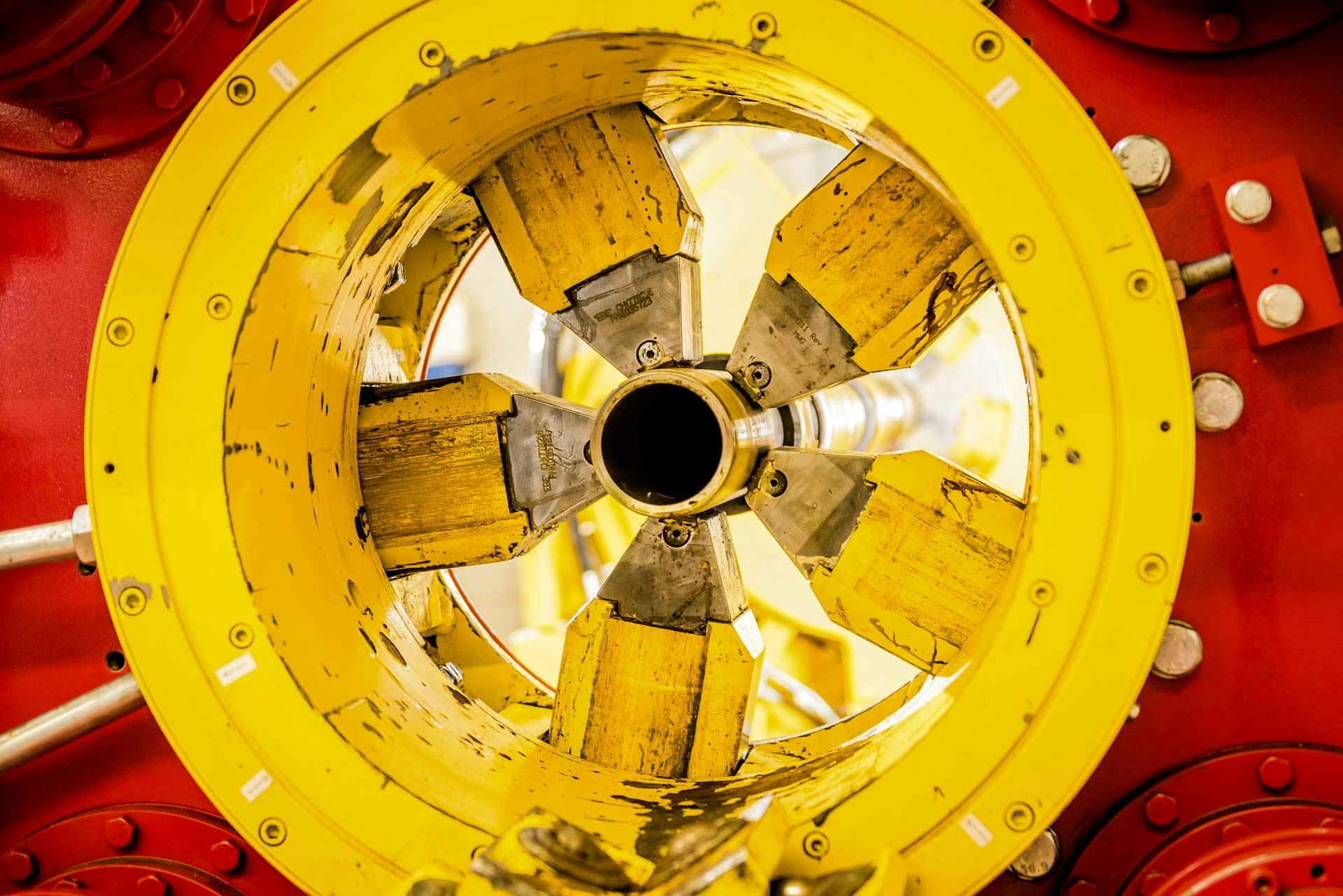 A GSL Liner Hanger used for well construction is held by machinery during manufacturing