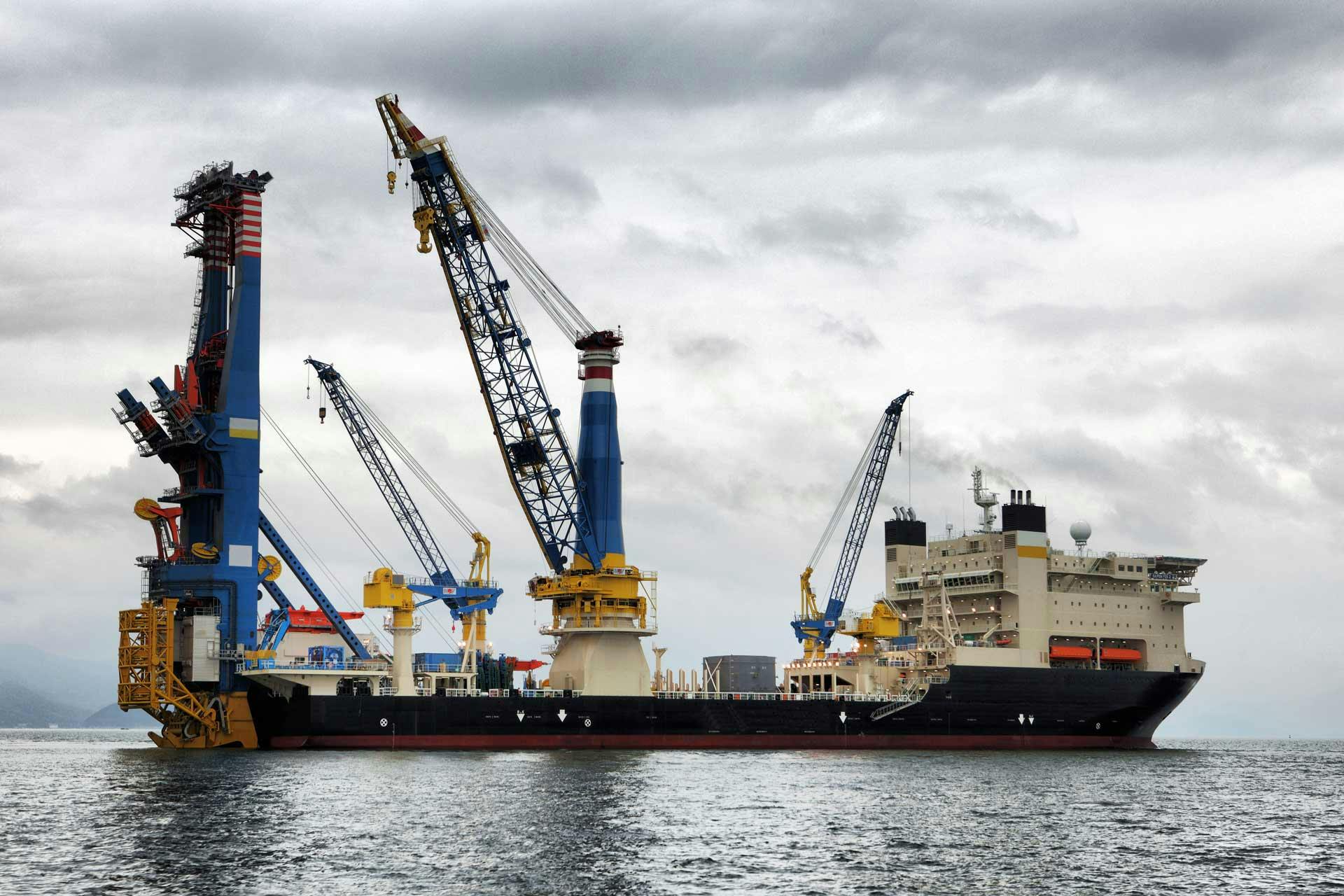 View of a set of cranes on a drilling vessel at sea