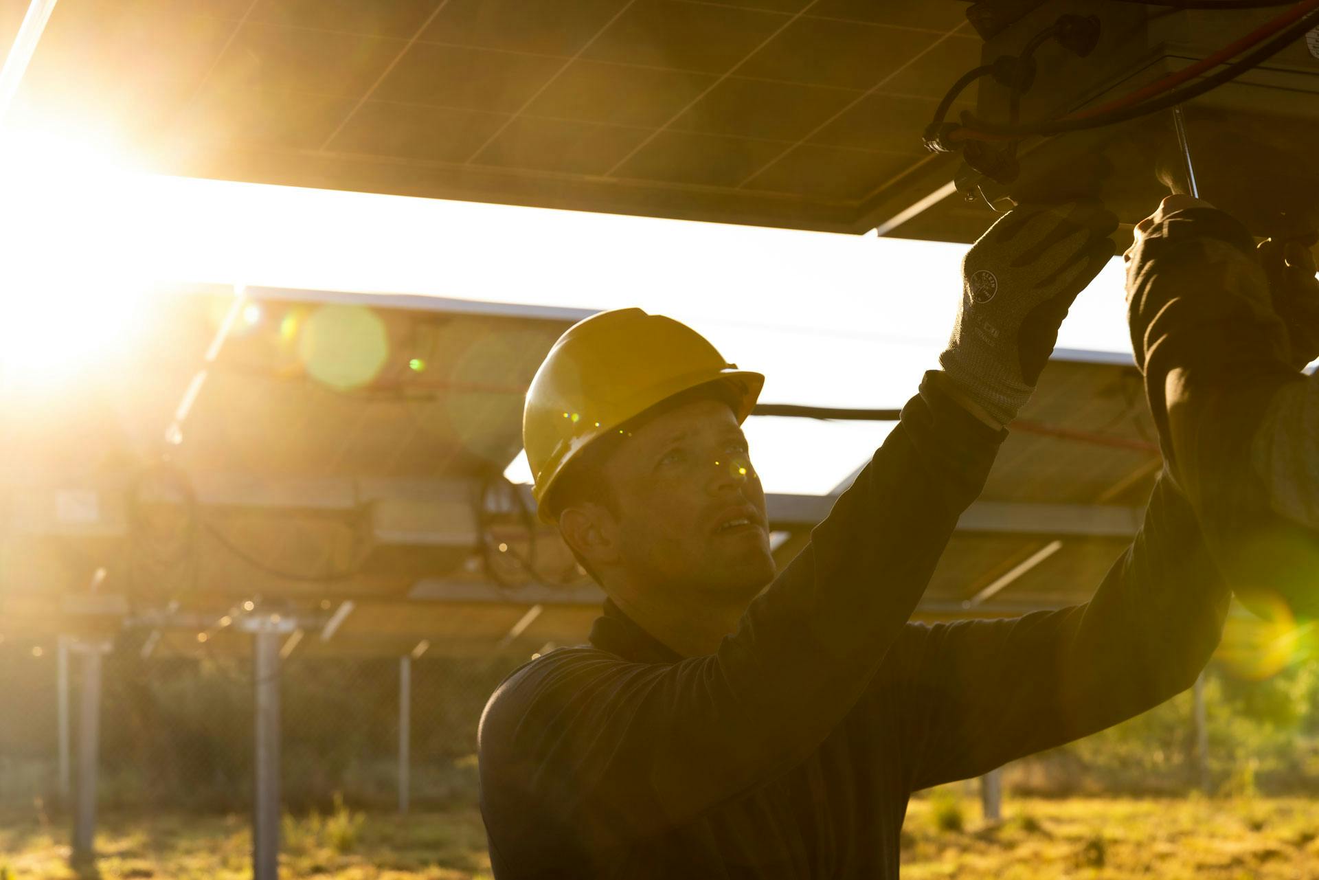 NOV technician working on solar panels