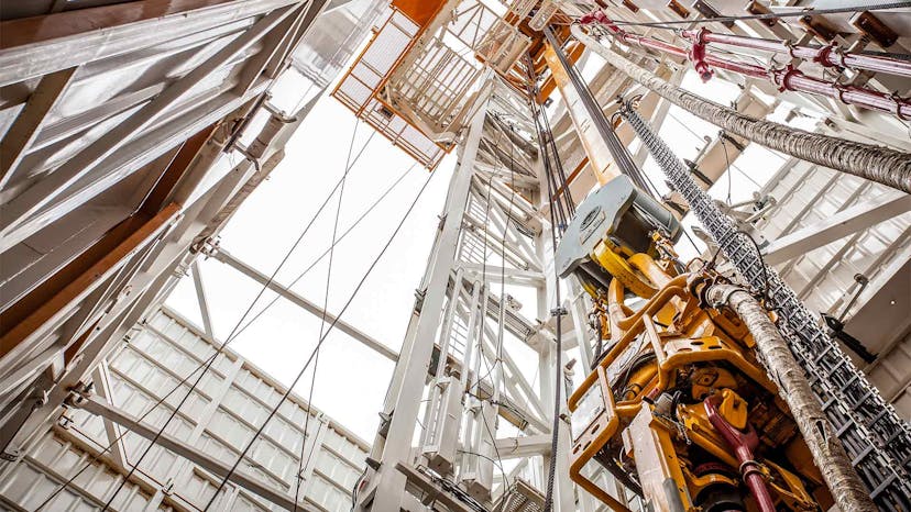 Top drive being lifted to the top of a derrick